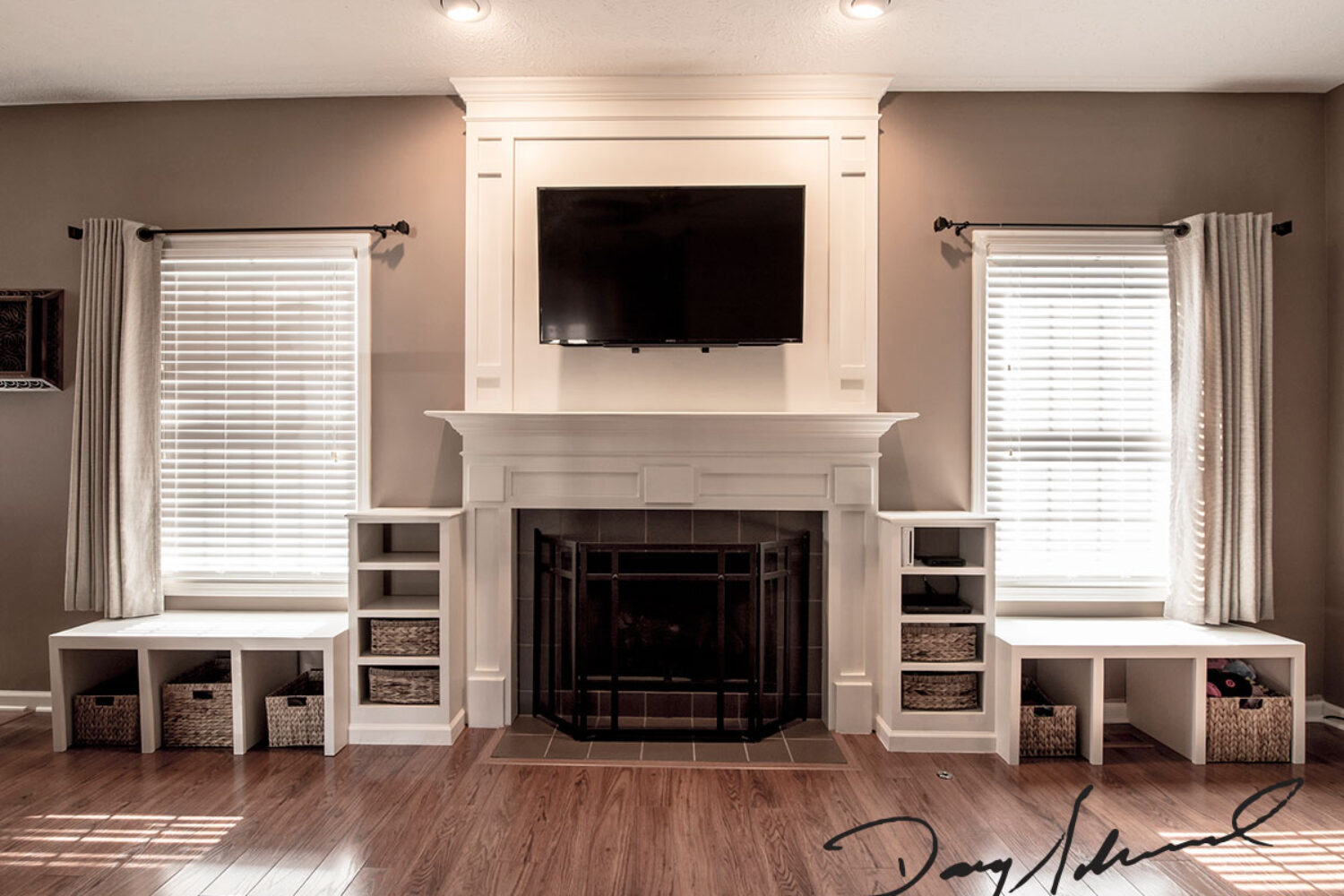 Innovative Fireplace Mantle with wall mounted television and custom storage