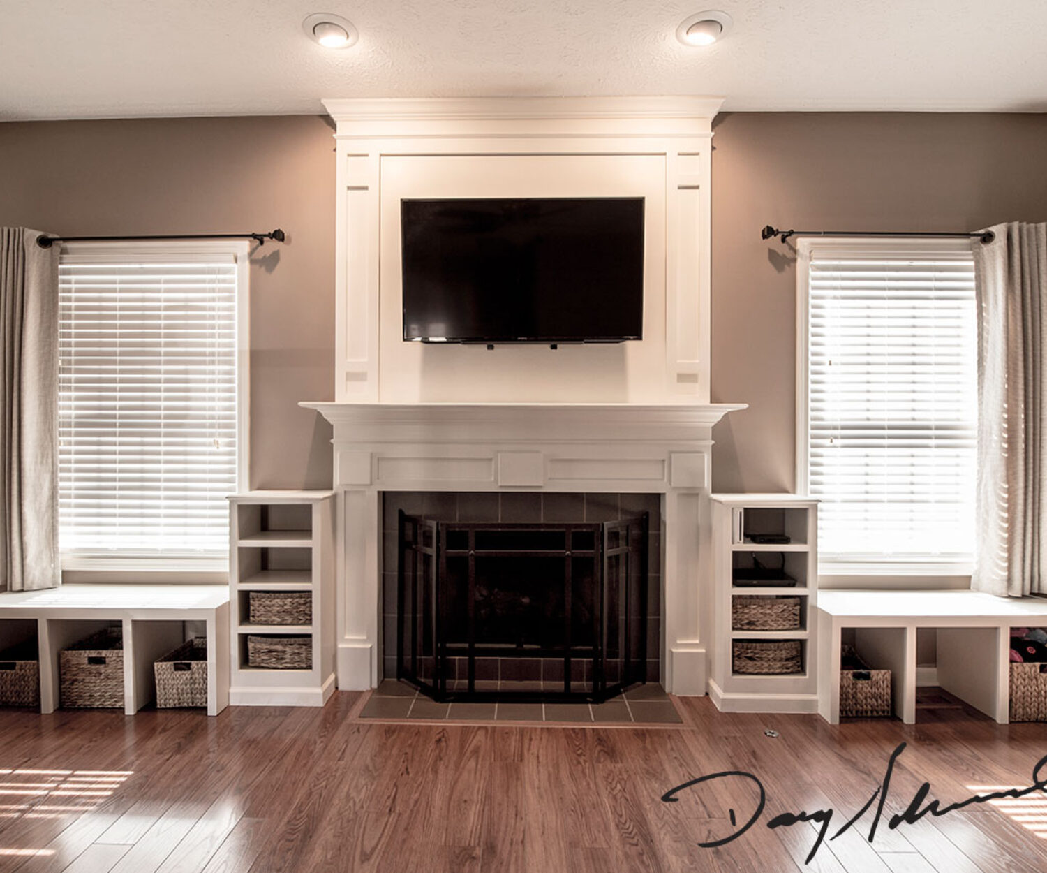 Innovative Fireplace Mantle with wall mounted television and custom storage